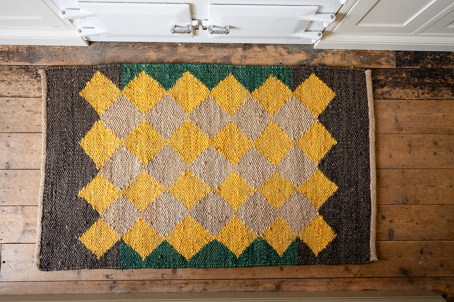 Jute Diamond Rug in Earthy Yellow, Brown and Green.